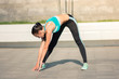 © patramansky - Beautiful fit young woman urban fitness stretching