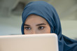 © onoky - Close-up of an Arab businesswoman using a laptop