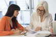 © onoky - Two businesswomen working in an office