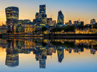 Wall Mural - Illuminated London cityscape at sunset with reflection from river Thames