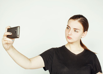 Wall Mural - young pretty teenage girl making selfie isolated on white background close up