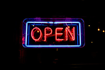 Wall Mural - neon OPEN sign welcomes customers