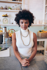 Wall Mural - Confident young woman juice bar owner