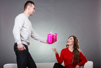 happy romantic couple with gift