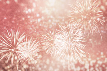 Defocused Rose Gold Fireworks And Bokeh At New Year And Copy Space. Abstract Background Holiday.