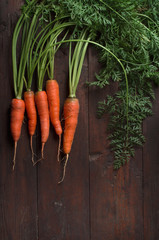 Wall Mural - Carrot on a wooden table