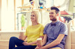 © Syda Productions - happy man and woman drinking coffee in office