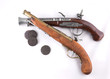 Old wooden guns and coins