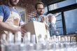 © Westend61 - Two colleagues shipping liquor in a distillery