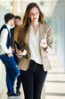 © ADDICTIVE STOCK - Beautiful young businesswoman using her mobile phone.