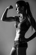 © F8  \ Suport Ukraine - Athletic young woman showing muscles  hands