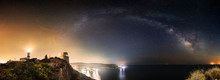 The Arch Of The Milky Way Galaxy Over A Lighthouse