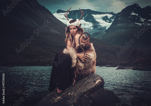 Nordic goddess in ritual garment near wild mountain lake in Innerdalen valley Poster Mural XXL