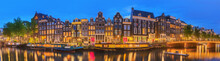 Amstel River, Canals And Night View Of Beautiful Amsterdam City. Netherlands