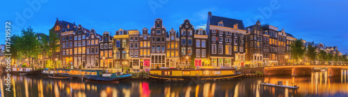 Amstel river, canals and night view of beautiful Amsterdam city Wallpaper Mural