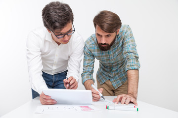 Two colleagues working together at office