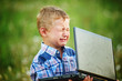 © fisher05 - Little boy crying bitterly, holding the laptop