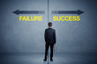 © ra2 studio - Businessman standing in front of success and failure arrow conce
