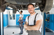 © didesign - Smiling mechanic with tools