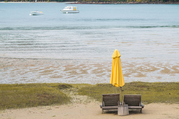 wooden chairs side the beach. 