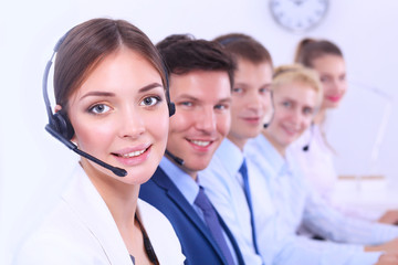 Wall Mural - Smiling positive young businesspeople and colleagues in a call center office