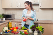 © stacestock - Girl having fun with vegetables in home kitchen