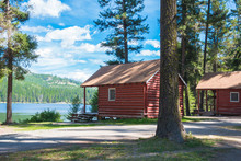 Rustic Log Cabins In Forest On Fishing Lake In A Resort Campground