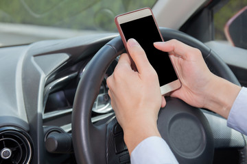 Businessman texting, chatting, playing on phone while careless driving