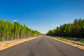 Unfinished asphalt country road