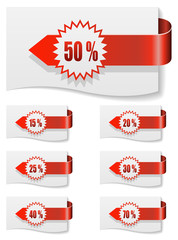 Wall Mural - Red discount labels bent around paper.