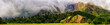 Mountain panorama, forest and clouds.