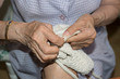 © gitanna - Details of a dressmaker weaving a cushion