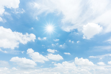 Wall Mural - Blue sky with clouds and sun reflection. looking up view