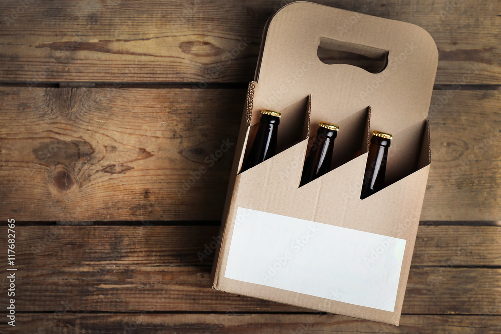 Paper beer package  on wooden background