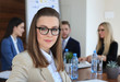 © ty - business woman with her staff, people group in background at modern bright office indoors