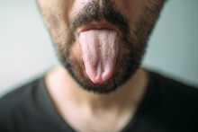 Adult Unshaven Man Sticking Tongue Out