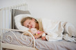 © unguryanu - Sweet little girl asleep in her bed.