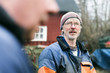 © Astrakan Images - Mature fisherman with colleague in foreground