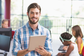 Poster - Teacher using digital tablet in classroom