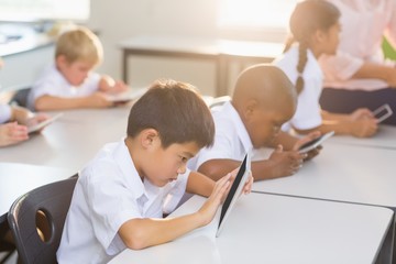 Poster - School kids using digital tablet in classroom
