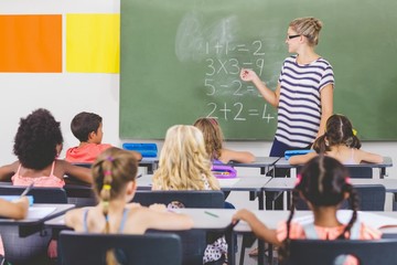 Poster - Teacher teaching mathematics to school kids in classroom