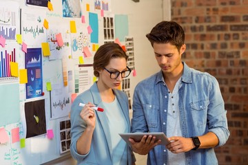 Poster - Business executives discussing over digital tablet