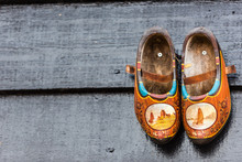 Traditional Dutch Wooden Shoes Hanging At A Wall