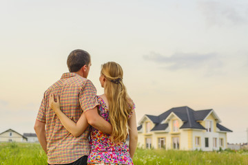 Wall Mural - young couple near his house