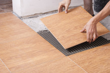 Laying Tiles On The Floor