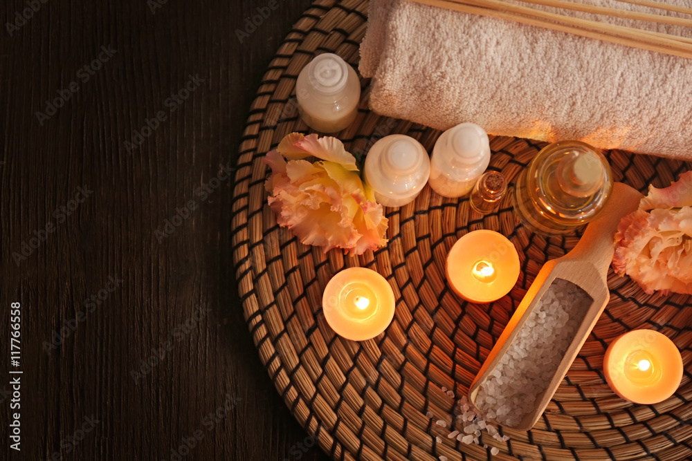 Beautiful spa composition with flowers on wooden background