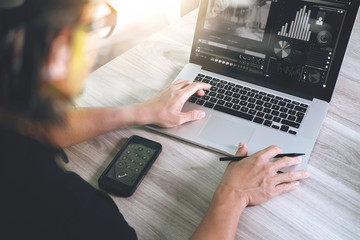 designer hand attending video conference with laptop computer an