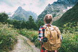 Fototapeta  - Hiker walking to mountains