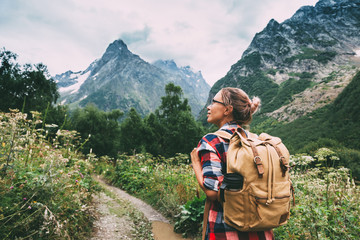 hiker walking to mountains