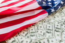 Close Up Of American Flag And Dollar Cash Money
